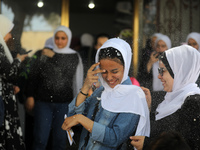 Palestinian students celebrate the last day in their final high school exams, known as ''Tawjihi'', in Gaza city on July 04, 2022.  (