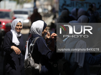 Palestinian students celebrate the last day in their final high school exams, known as ''Tawjihi'', in Gaza city on July 04, 2022.  (