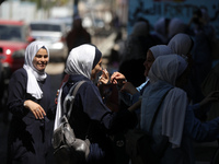 Palestinian students celebrate the last day in their final high school exams, known as ''Tawjihi'', in Gaza city on July 04, 2022.  (