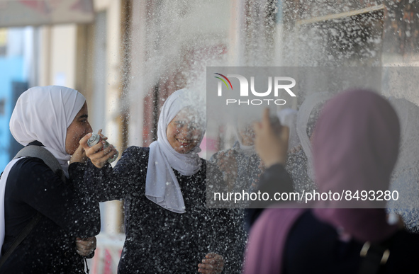 Palestinian students celebrate the last day in their final high school exams, known as ''Tawjihi'', in Gaza city on July 04, 2022.  