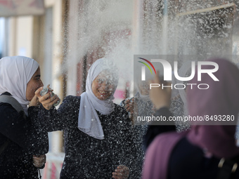 Palestinian students celebrate the last day in their final high school exams, known as ''Tawjihi'', in Gaza city on July 04, 2022.  (