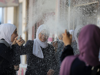 Palestinian students celebrate the last day in their final high school exams, known as ''Tawjihi'', in Gaza city on July 04, 2022.  (