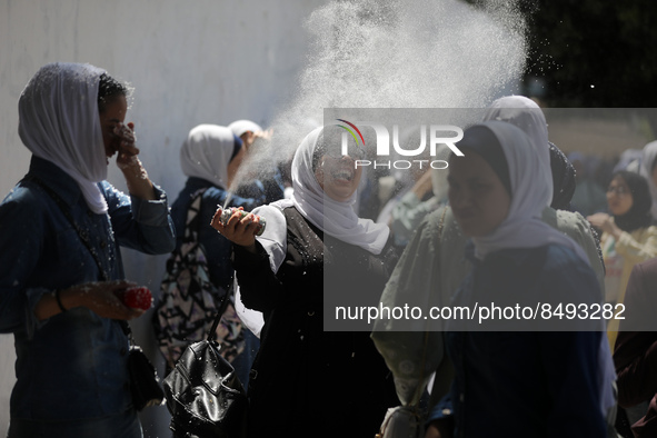 Palestinian students celebrate the last day in their final high school exams, known as ''Tawjihi'', in Gaza city on July 04, 2022.  