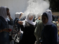 Palestinian students celebrate the last day in their final high school exams, known as ''Tawjihi'', in Gaza city on July 04, 2022.  (