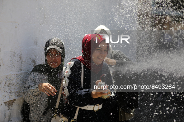 Palestinian students celebrate the last day in their final high school exams, known as ''Tawjihi'', in Gaza city on July 04, 2022.  