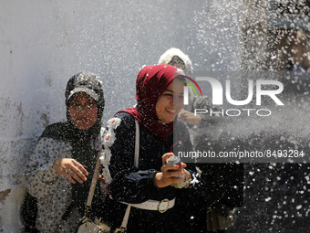 Palestinian students celebrate the last day in their final high school exams, known as ''Tawjihi'', in Gaza city on July 04, 2022.  (