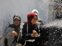 Palestinian students celebrate the last day in their final high school exams, known as ''Tawjihi'', in Gaza city on July 04, 2022.  (