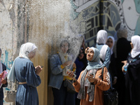 Palestinian students celebrate the last day in their final high school exams, known as ''Tawjihi'', in Gaza city on July 04, 2022.  (