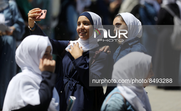 Palestinian students celebrate the last day in their final high school exams, known as ''Tawjihi'', in Gaza city on July 04, 2022.  