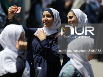 Palestinian students celebrate the last day in their final high school exams, known as ''Tawjihi'', in Gaza city on July 04, 2022.  (