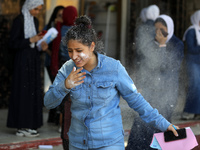 Palestinian students celebrate the last day in their final high school exams, known as ''Tawjihi'', in Gaza city on July 04, 2022.  (