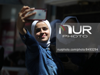 Palestinian students celebrate the last day in their final high school exams, known as ''Tawjihi'', in Gaza city on July 04, 2022.  (