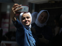 Palestinian students celebrate the last day in their final high school exams, known as ''Tawjihi'', in Gaza city on July 04, 2022.  (