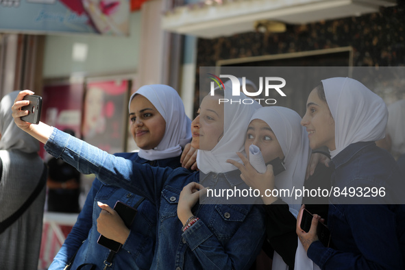 Palestinian students celebrate the last day in their final high school exams, known as ''Tawjihi'', in Gaza city on July 04, 2022.  