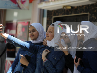 Palestinian students celebrate the last day in their final high school exams, known as ''Tawjihi'', in Gaza city on July 04, 2022.  (