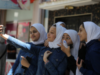 Palestinian students celebrate the last day in their final high school exams, known as ''Tawjihi'', in Gaza city on July 04, 2022.  (