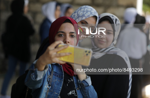 Palestinian students celebrate the last day in their final high school exams, known as ''Tawjihi'', in Gaza city on July 04, 2022.  