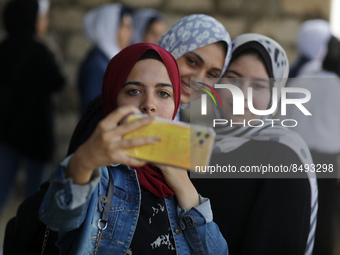 Palestinian students celebrate the last day in their final high school exams, known as ''Tawjihi'', in Gaza city on July 04, 2022.  (