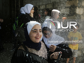 Palestinian students celebrate the last day in their final high school exams, known as ''Tawjihi'', in Gaza city on July 04, 2022.  (