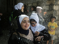 Palestinian students celebrate the last day in their final high school exams, known as ''Tawjihi'', in Gaza city on July 04, 2022.  (