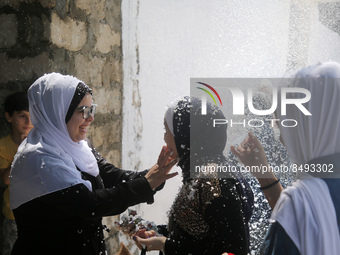 Palestinian students celebrate the last day in their final high school exams, known as ''Tawjihi'', in Gaza city on July 04, 2022.  (