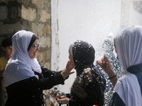 Palestinian students celebrate the last day in their final high school exams, known as ''Tawjihi'', in Gaza city on July 04, 2022.  (