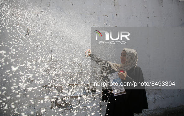 Palestinian students celebrate the last day in their final high school exams, known as ''Tawjihi'', in Gaza city on July 04, 2022.  