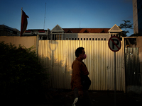 A man wear protective face masks while walking at pedestrian in Jakarta on 5 July 2022. The Indonesian government on Tuesday, July 5, raised...