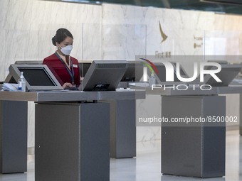 A Cathay Pacific Workers standing at a booth inside Hong Kong International Airport on July 7, 2022 in Hong Kong, China. The Hong Kong Gover...