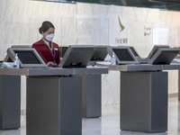 A Cathay Pacific Workers standing at a booth inside Hong Kong International Airport on July 7, 2022 in Hong Kong, China. The Hong Kong Gover...