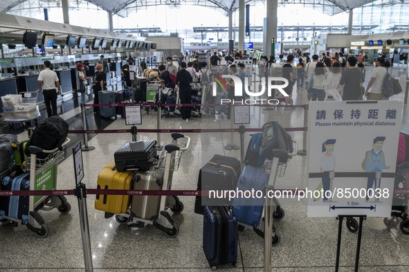 Luggage lining up at a check in counter inside Hong Kong International Airport on July 7, 2022 in Hong Kong, China. The Hong Kong Government...