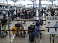 Luggage lining up at a check in counter inside Hong Kong International Airport on July 7, 2022 in Hong Kong, China. The Hong Kong Government...