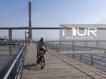 People are seen performing outdoor activities near the Herois do Mar promenade, in the vicinity of the Vasco da Gama bridge. Lisbon 03 July...