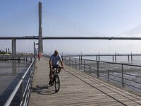 People are seen performing outdoor activities near the Herois do Mar promenade, in the vicinity of the Vasco da Gama bridge. Lisbon 03 July...