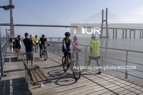 People are seen performing outdoor activities near the Herois do Mar promenade, in the vicinity of the Vasco da Gama bridge. Lisbon 03 July...