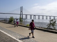 People are seen performing outdoor activities near the Herois do Mar promenade, in the vicinity of the Vasco da Gama bridge. Lisbon 03 July...