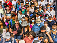 People crowd onto a ferry boat going from Toronto to Centre Island at the ferry terminal in Toronto, Ontario, Canada on July 08, 2022. Heath...