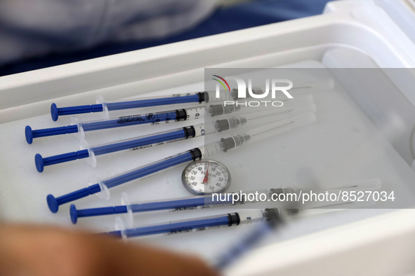  A health worker prepares a Pfizer's Covid19 dose during a mass vaccination campaign for  children under 9 years of age  to prevent infectio...