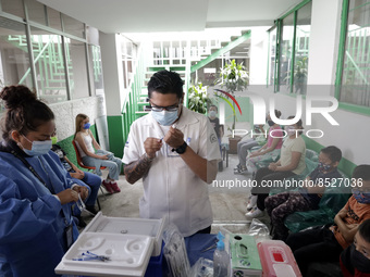  A health worker prepares a Pfizer's Covid19 dose during a mass vaccination campaign for  children under 9 years of age  to prevent infectio...