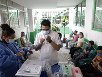  A health worker prepares a Pfizer's Covid19 dose during a mass vaccination campaign for  children under 9 years of age  to prevent infectio...