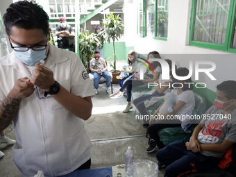  A health worker prepares a Pfizer's Covid19 dose during a mass vaccination campaign for  children under 9 years of age  to prevent infectio...