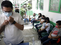  A health worker prepares a Pfizer's Covid19 dose during a mass vaccination campaign for  children under 9 years of age  to prevent infectio...