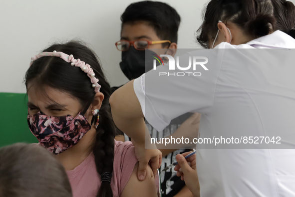  A child receives a Pfizer first dose at the  Portales Health Center during a health campaign to children under 9 years of age  at the start...