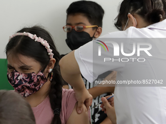  A child receives a Pfizer first dose at the  Portales Health Center during a health campaign to children under 9 years of age  at the start...