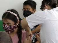  A child receives a Pfizer first dose at the  Portales Health Center during a health campaign to children under 9 years of age  at the start...