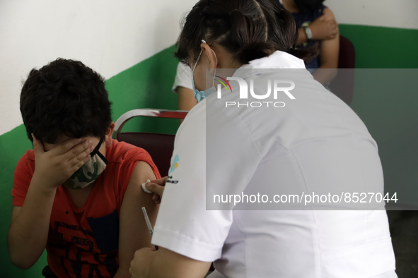  A child receives a Pfizer first dose at the  Portales Health Center during a health campaign to children under 9 years of age  at the start...