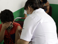  A child receives a Pfizer first dose at the  Portales Health Center during a health campaign to children under 9 years of age  at the start...