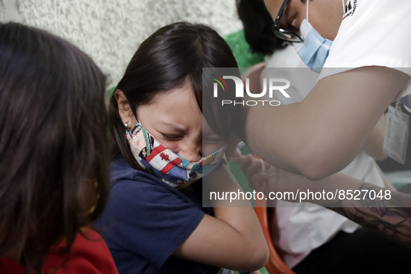  A child receives a Pfizer first dose at the  Portales Health Center during a health campaign to children under 9 years of age  at the start...