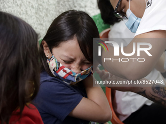  A child receives a Pfizer first dose at the  Portales Health Center during a health campaign to children under 9 years of age  at the start...