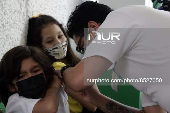  A child receives a Pfizer first dose at the  Portales Health Center during a health campaign to children under 9 years of age  at the start...